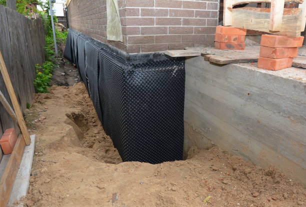 SJ Waterproofing Pros technician performing targeted Interior Drainage System assessment in Covington, KY
